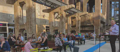 Guest speaker presenting his science at local outdoor bar